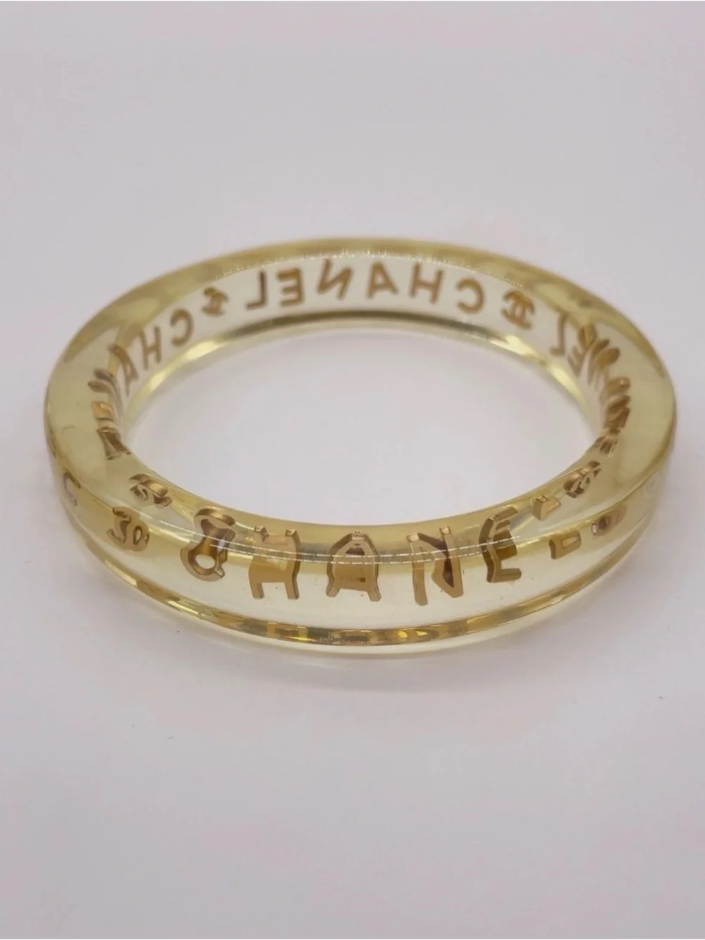 CHANEL LUCITE & Gold Letter Clear Acrylic Bangle - Picture 10 of 12